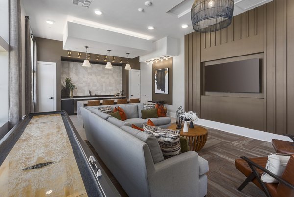 Clubhouse featuring modern design and spacious seating at Alta Surprise Apartments, luxury living within Greystar communities
