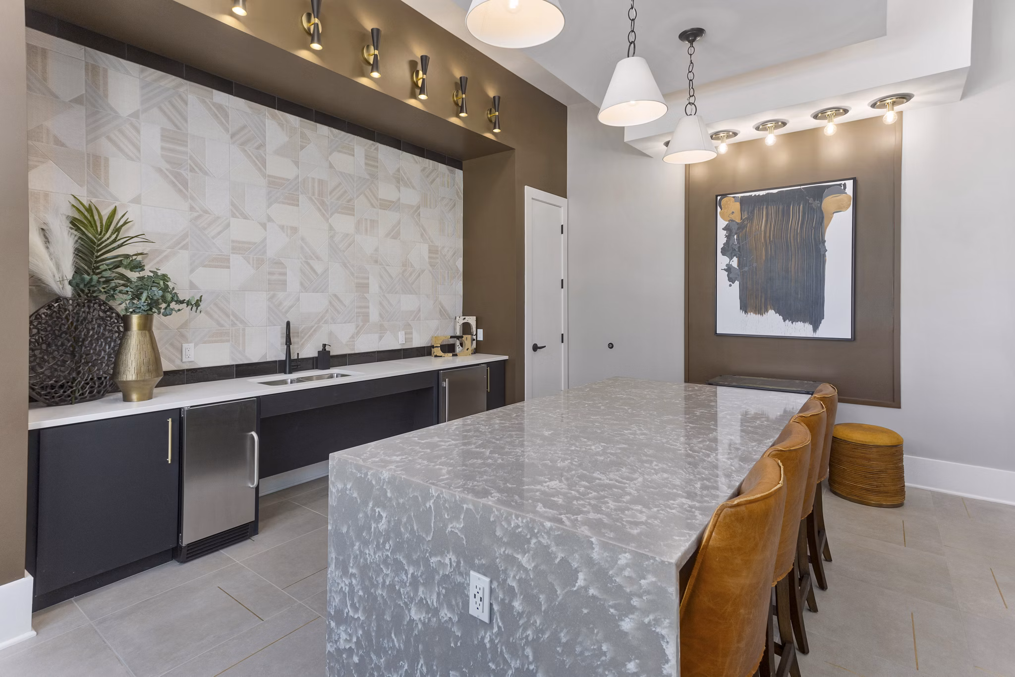 Clubhouse at Alta Surprise: Modern clubhouse with stylish dÃ©cor and ample seating in Alta Surprise Apartments