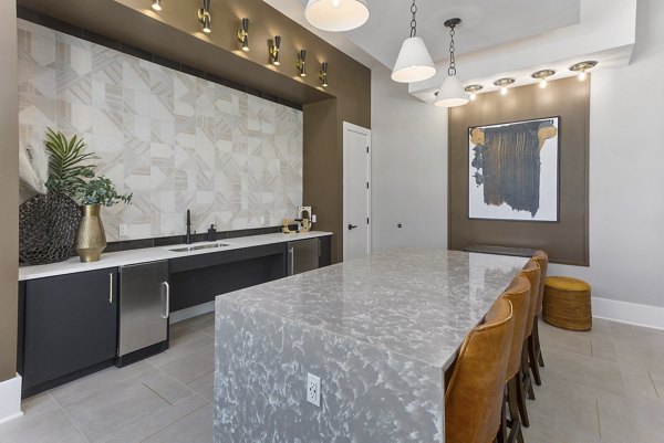 Clubhouse at Alta Surprise: Modern clubhouse with stylish dÃ©cor and ample seating in Alta Surprise Apartments