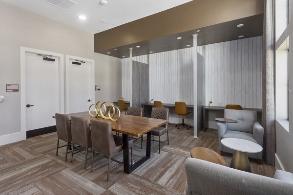 Clubhouse with stylish interiors at Alta Surprise Apartments, a luxury community with modern design and recreational spaces
