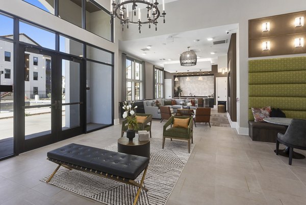 Clubhouse featuring modern design and lounge seating at Alta Surprise Apartments, a luxury community by Greystar in Surprise, Arizona