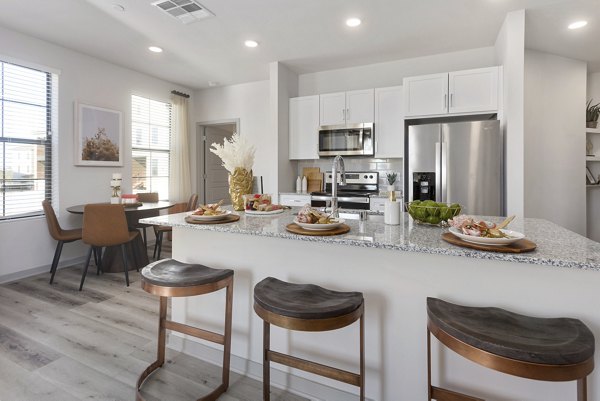Alta Surprise Apartments: Modern kitchen with stainless steel appliances and granite countertops in Greystar's luxury apartment community