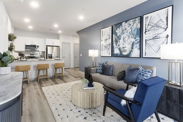 Spacious living room with modern decor and natural light in Alta Surprise Apartments