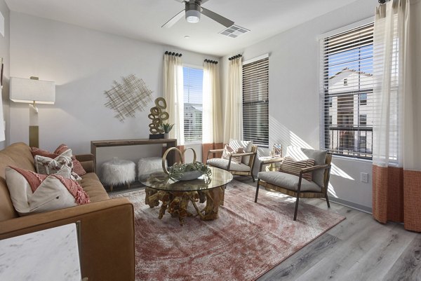Spacious living room with modern furnishings in Alta Surprise Apartments luxury property