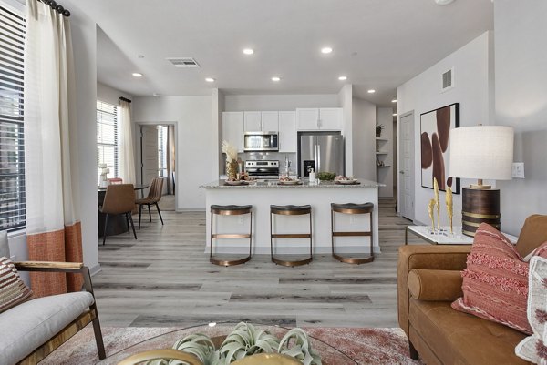 Alta Surprise Apartments: Modern living room with sleek furniture and natural lighting