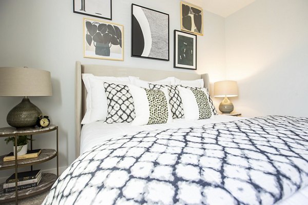 Cozy bedroom with modern decor at Alta Town Center Apartments, Greystar luxury community