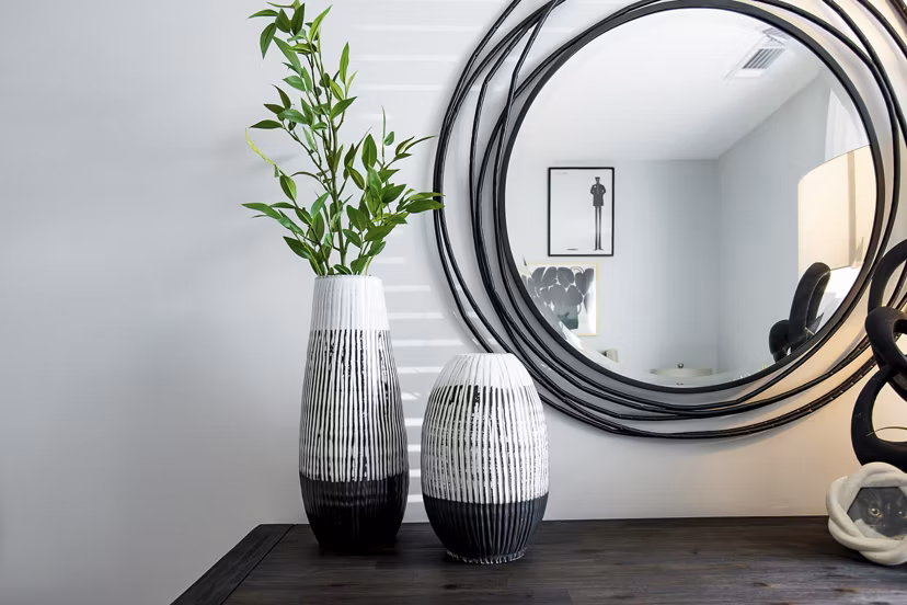 Cozy bedroom with neutral palette and large window at Alta Town Center Apartments