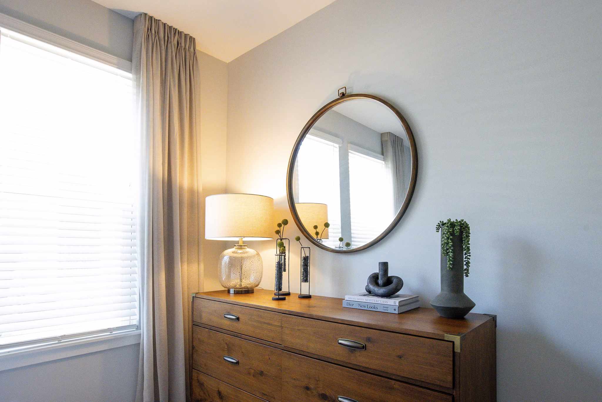 Cozy bedroom with modern decor at Alta Town Center Apartments, offering a comfortable living space in a luxury community