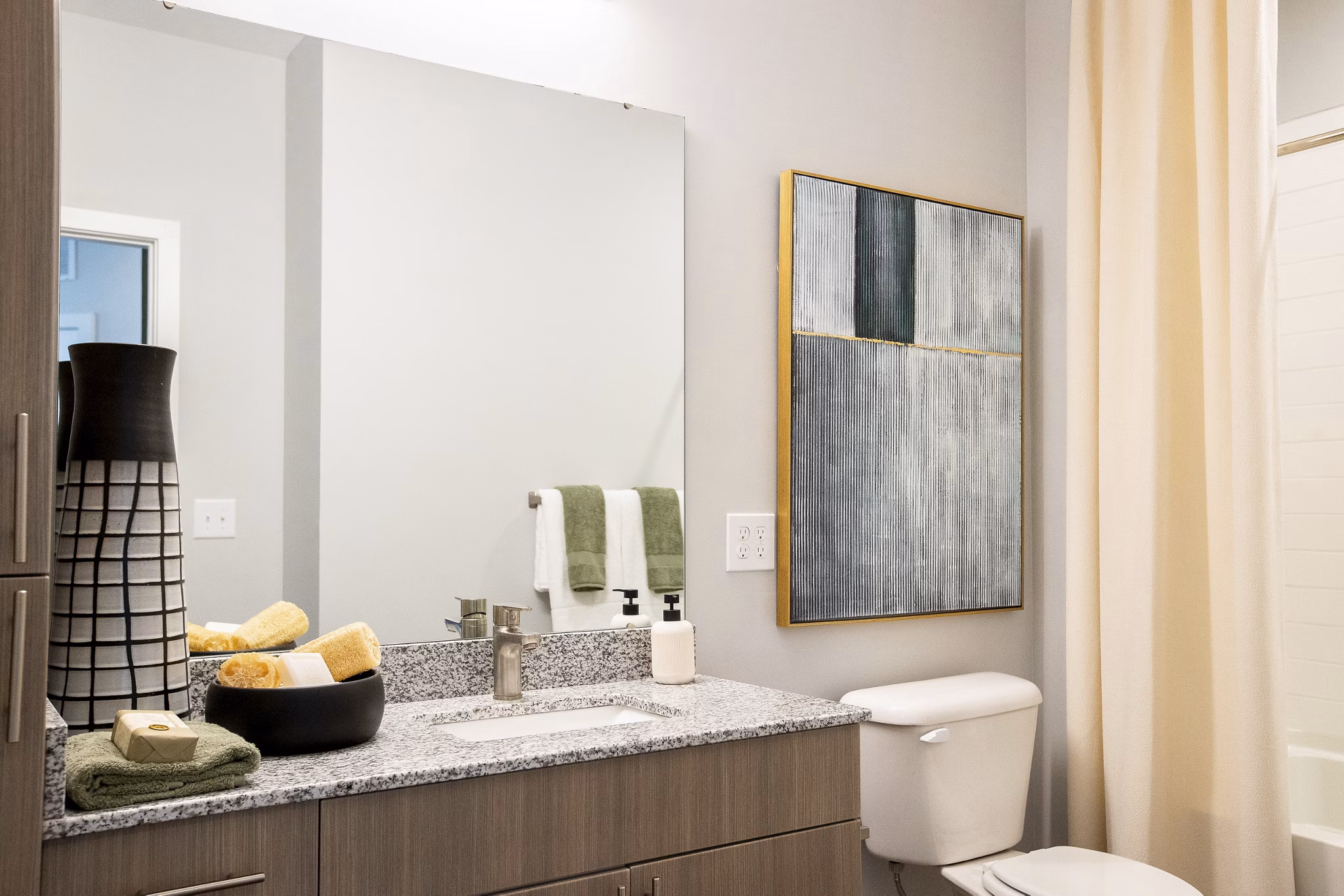 Bathroom featuring sleek fixtures and modern design at Alta Town Center Apartments