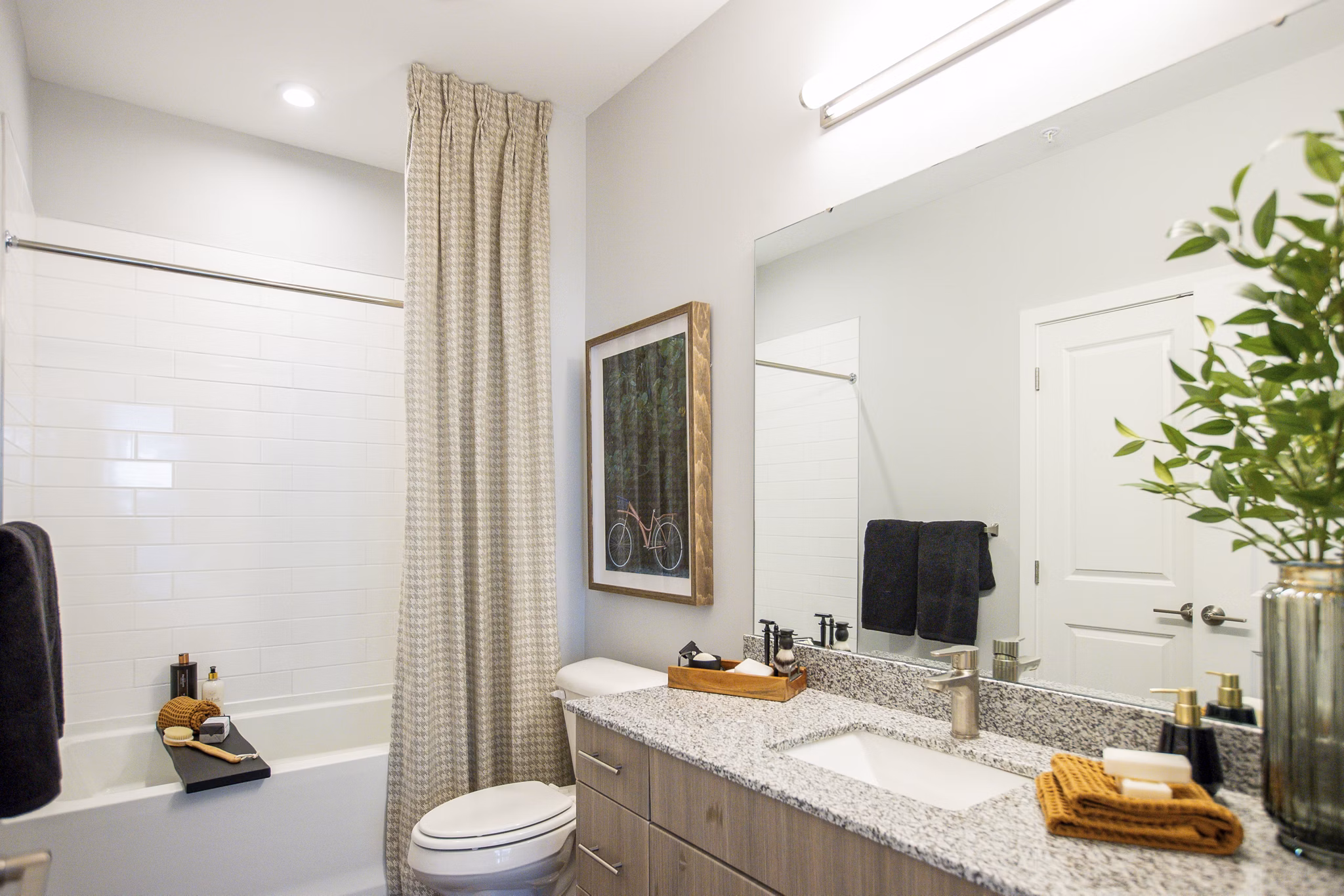Modern bathroom with elegant fixtures at Alta Town Center Apartments, offering luxury living in a Greystar property