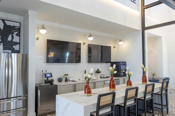 Clubhouse featuring modern seating and entertainment spaces at Alta Town Center Apartments in a Greystar community