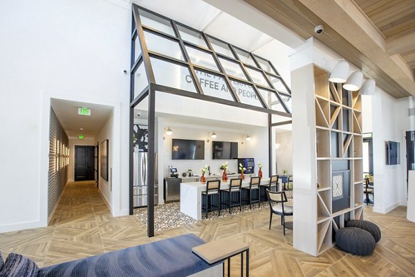 Clubhouse with modern decor and seating at Alta Town Center luxury apartments