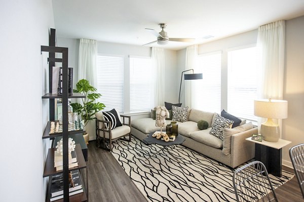 Living room featuring modern decor and ample natural light at Alta Town Center Apartments Ideal for luxurious living
