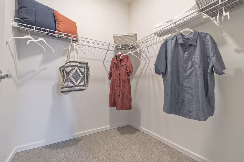 Cozy bedroom closet with modern decor at Alta University Place Apartments: luxury living in a convenient location