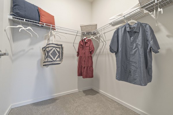Cozy bedroom closet with modern decor at Alta University Place Apartments: luxury living in a convenient location