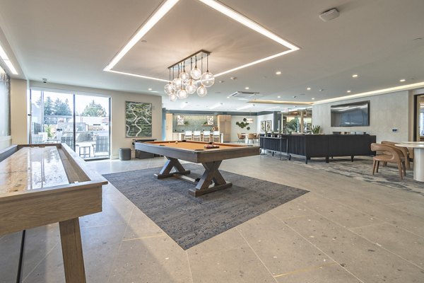 Modern clubroom with stylish seating and billiards at Alta University Place Apartments