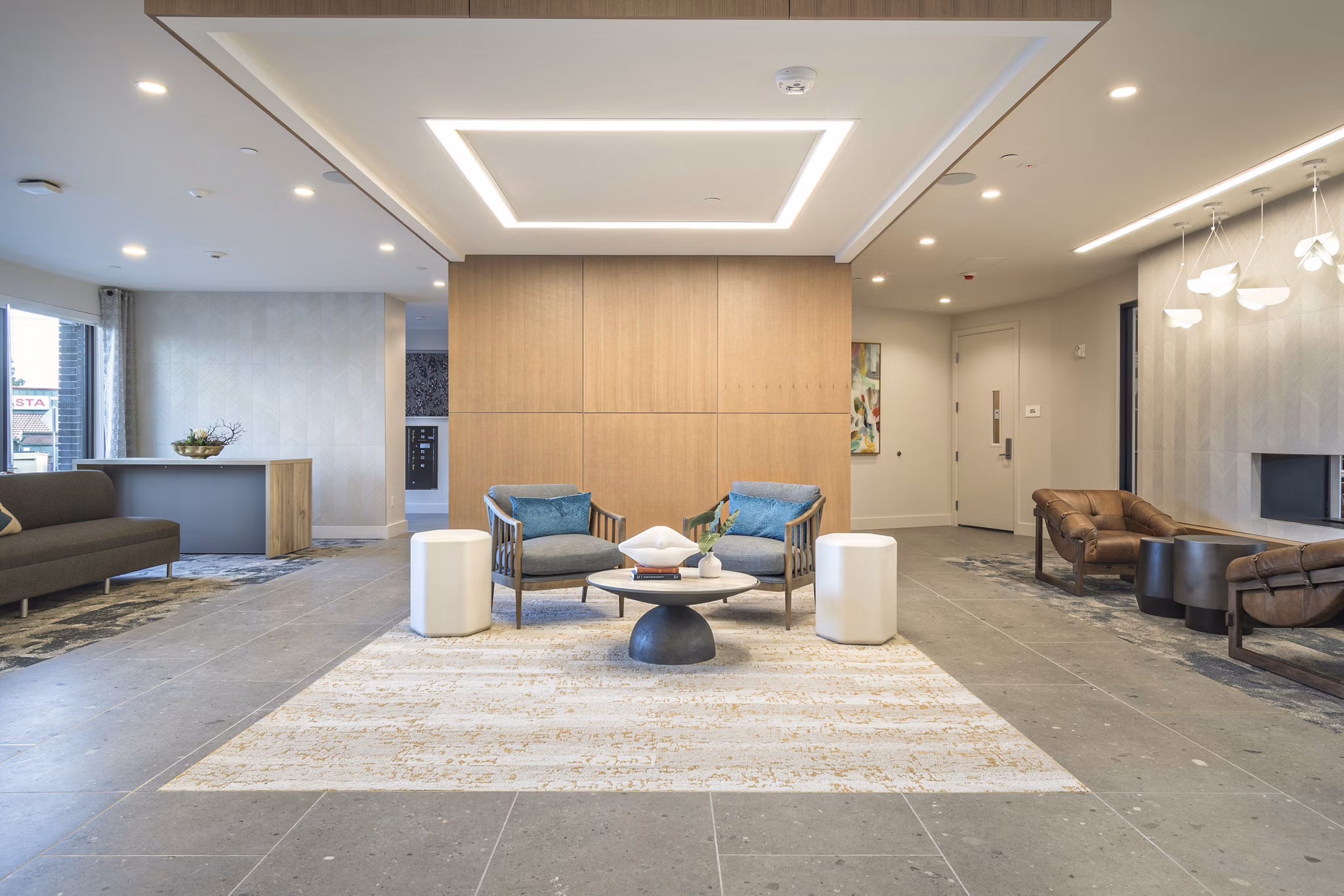 Clubroom featuring modern seating and large screen TV at Alta University Place Apartments