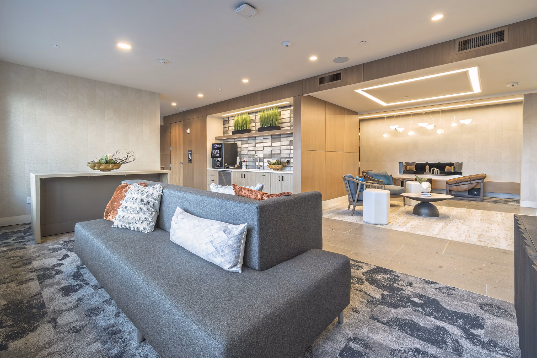 Clubroom with modern design and cozy seating at Alta University Place Apartments