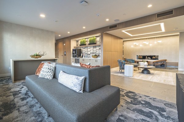 Clubroom with modern design and cozy seating at Alta University Place Apartments