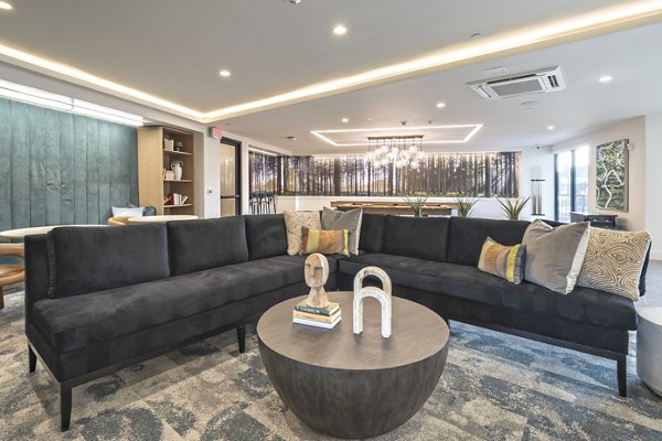 Clubroom featuring modern seating and entertainment options at Alta University Place Apartments
