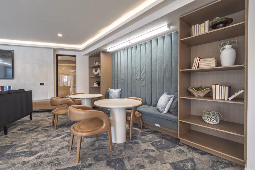 Stylish clubroom with modern seating and decor at Alta University Place Apartments