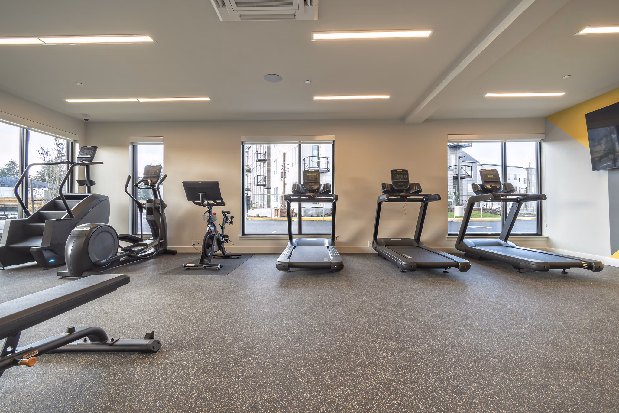 Modern fitness center with advanced equipment at Alta University Place Apartments