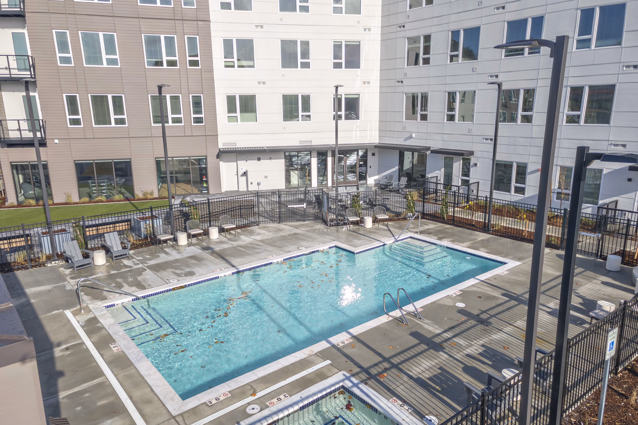 Luxurious poolside retreat at Alta University Place Apartments, ideal for relaxation and recreation in a stylish setting