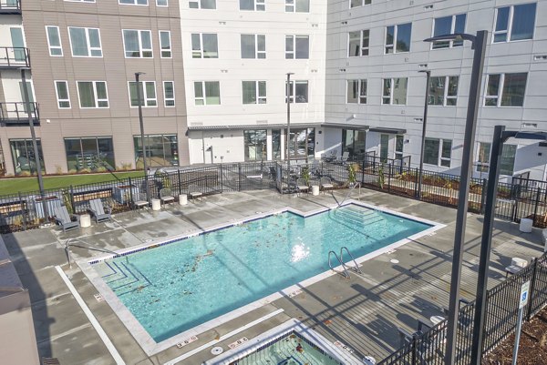Luxurious poolside retreat at Alta University Place Apartments, ideal for relaxation and recreation in a stylish setting