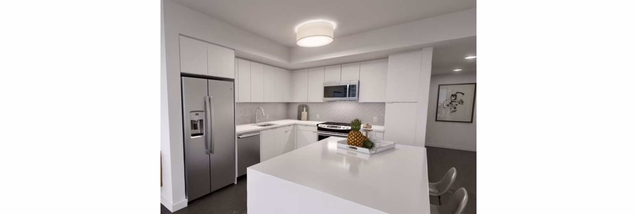 Modern kitchen with stainless steel appliances in Alta Waverly Apartments