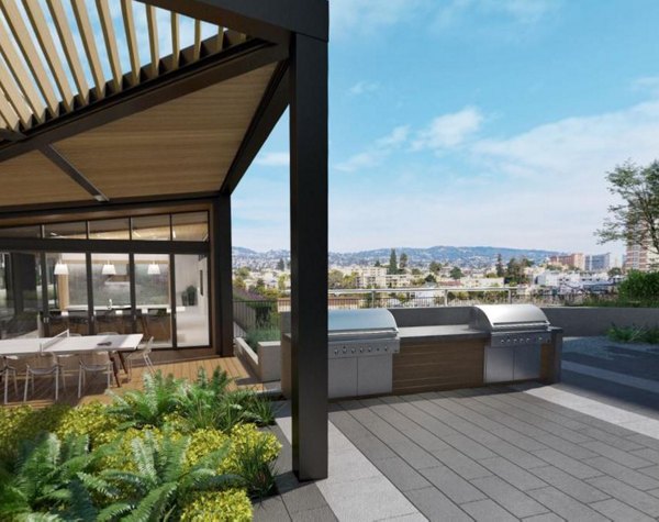 Recreational area featuring lush greenery and outdoor seating at Alta Waverly Apartments luxury development