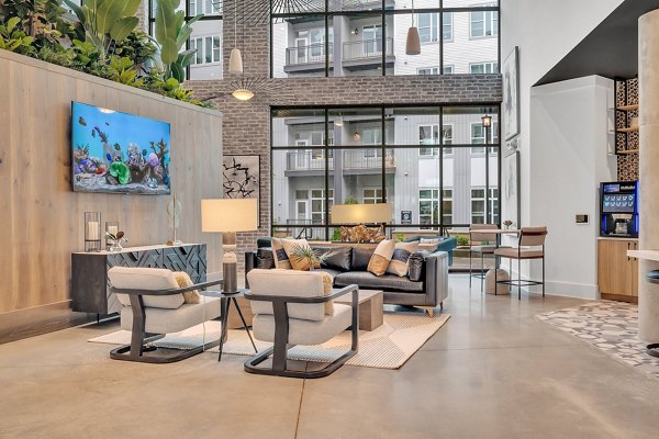 Spacious club house featuring modern decor at Alta West Morehead Apartments
