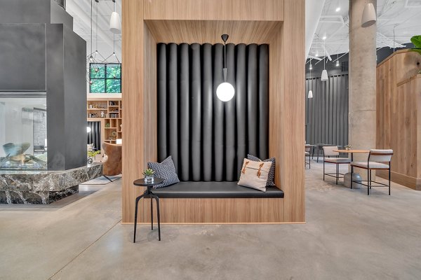 Clubhouse room featuring modern seating and decor at Alta West Morehead luxury apartments