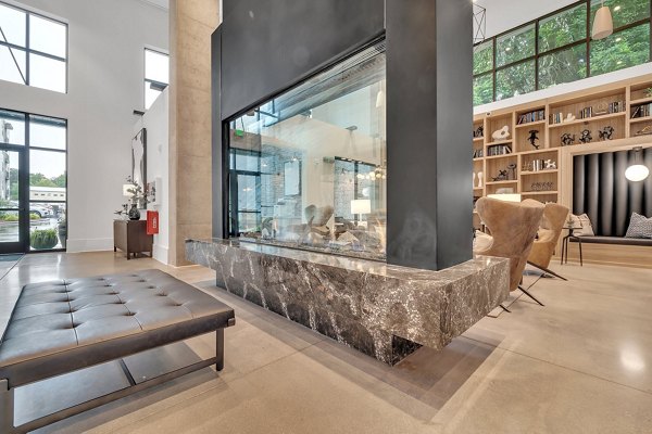 Clubhouse with modern decor and plush seating at Alta West Morehead luxury apartments