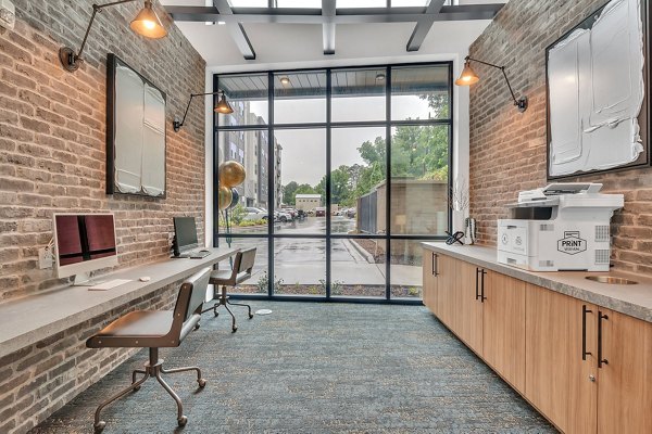 Clubhouse featuring modern seating and decor at Alta West Morehead Apartments