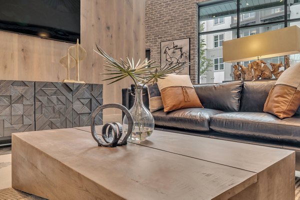 Club house room with cozy seating and modern decor at Alta West Morehead Apartments Perfect for gatherings and relaxation