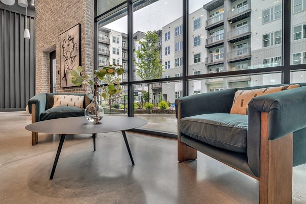 Clubhouse featuring elegant lounge seating at Alta West Morehead apartments