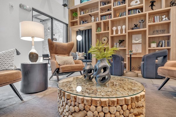 Clubhouse room featuring modern decor and communal spaces at Alta West Morehead Apartments