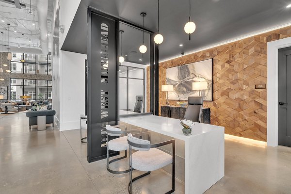 Clubhouse room featuring modern seating and decor at Alta West Morehead luxury apartments