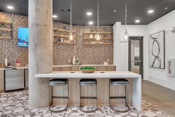 Club house room with cozy seating and modern decor at Alta West Morehead Apartment