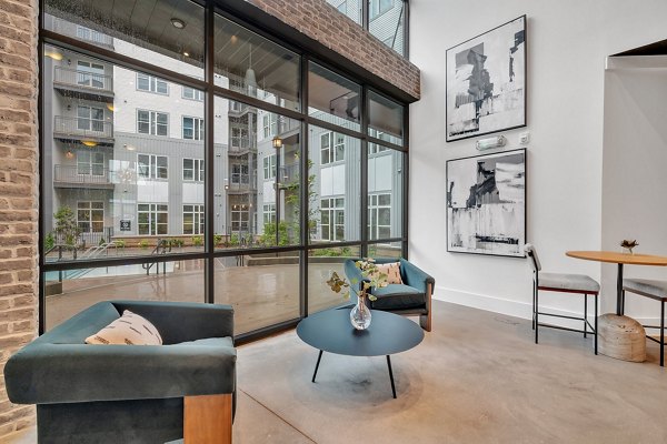 Club house room with modern seating and decor at Alta West Morehead apartments showcasing luxury lifestyle options