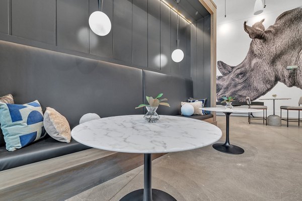 Clubhouse featuring modern seating and communal spaces at Alta West Morehead Apartments