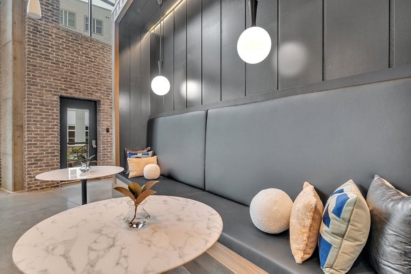 Club house room featuring comfy seating and modern decor at Alta West Morehead Apartments, luxury living in Charlotte
