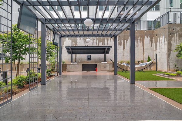 Inviting patio with seating and greenery at Alta West Moreheadle Apartments