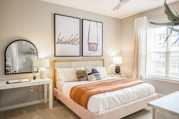 Elegant bedroom with modern furnishings at Alta Wren Apartments