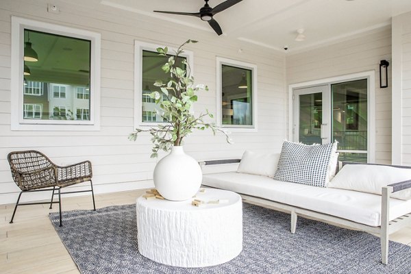 Modern clubhouse with stylish seating and pool table at Alta Wren Apartments, enhancing luxury living experiences