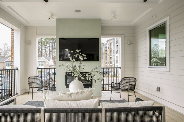 Clubhouse featuring modern decor and lounge seating at Alta Wren Apartments