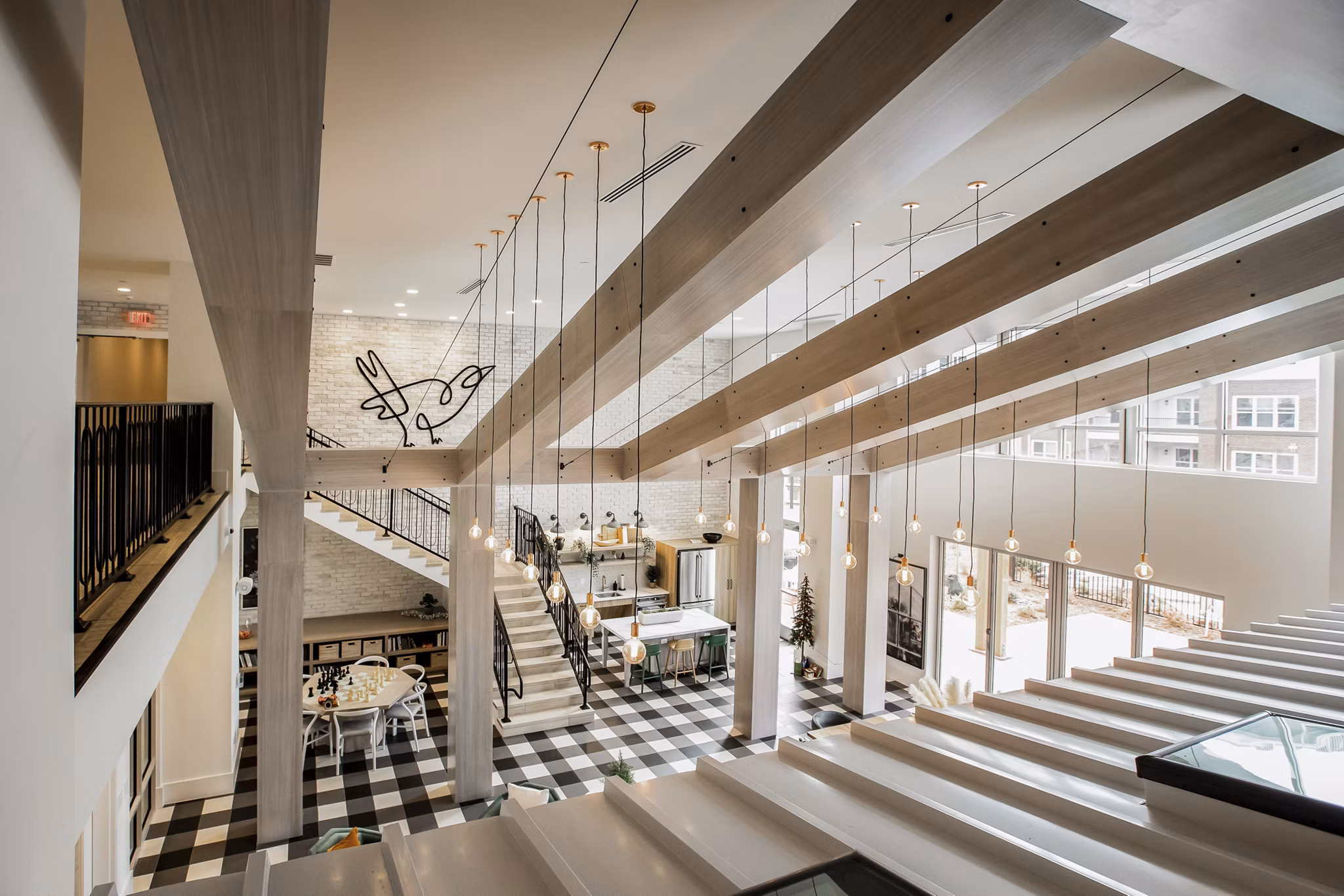 Clubhouse featuring elegant modern design at Alta Wren Apartments, luxury community by Greystar
