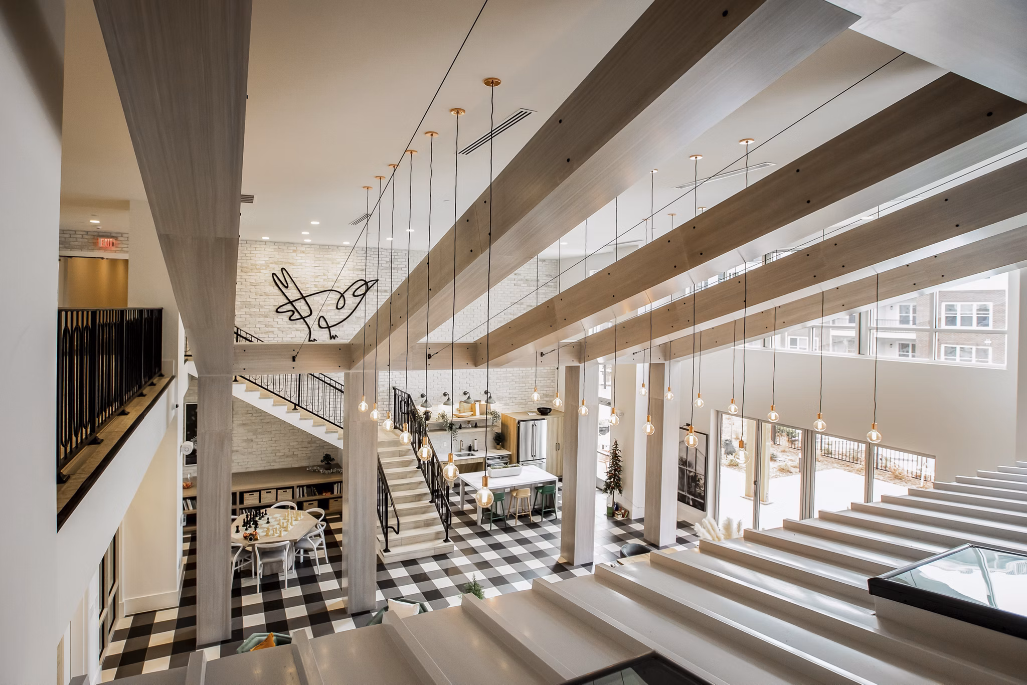Clubhouse featuring elegant modern design at Alta Wren Apartments, luxury community by Greystar