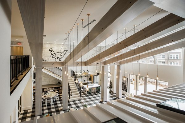 Clubhouse featuring elegant modern design at Alta Wren Apartments, luxury community by Greystar