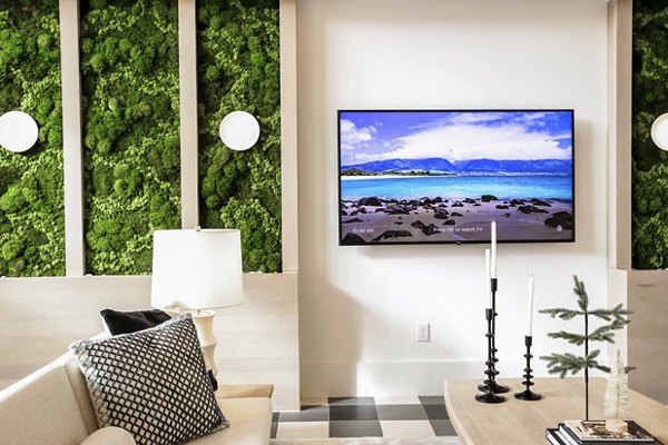 Clubhouse at Alta Wren Apartments: Luxurious space with modern decor and cozy seating for residents to relax and socialize